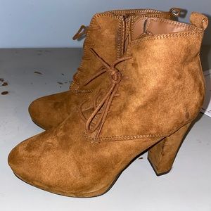 High heeled light brown shoes